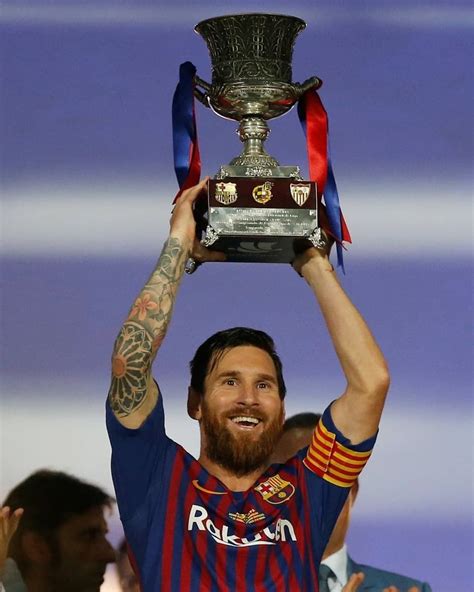 messi with the trophy