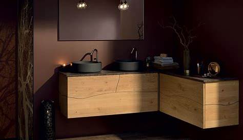 Un meuble de salle de bains en bois avec une vasque