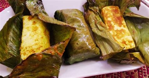 mexican food wrapped in banana leaves