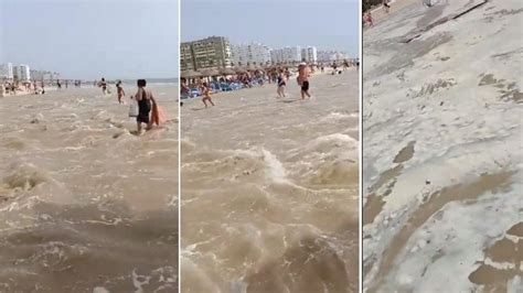 Mini tsunami engulfs tourist beach in dramatic footage as sunloungers