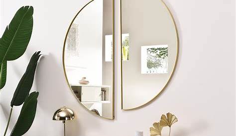 aménagement intérieur de salon avec grand miroir doré