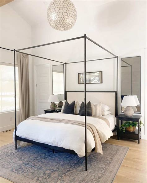 mirror behind bed with canopy