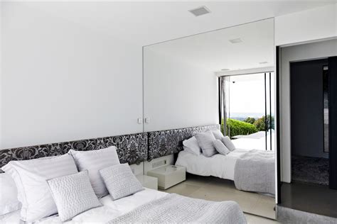 Mirror on an empty bedroom wall