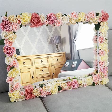 Mirrors With Flowers Around It