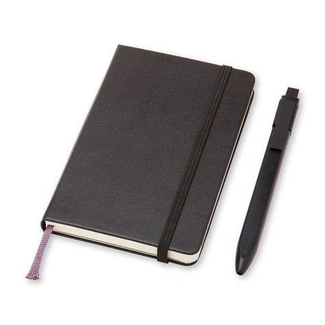 moleskine notebook and pen