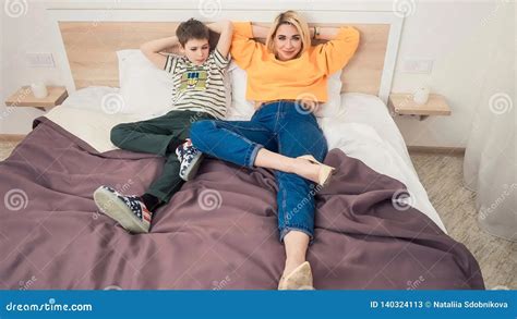 Mother Plays with Son in Bed Stock Photo Image of child, leisure