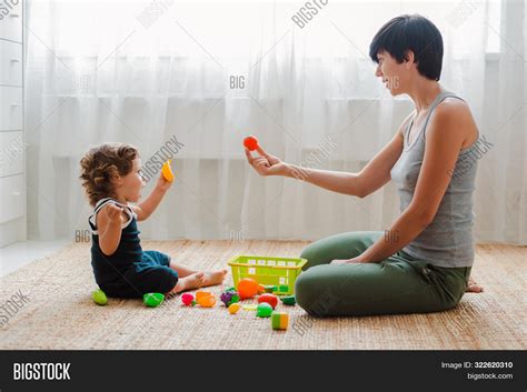 mom and baby playing