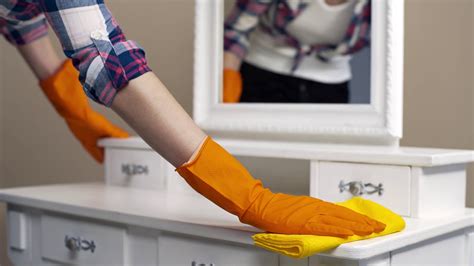 mom cleaning the house with rubber gloves
