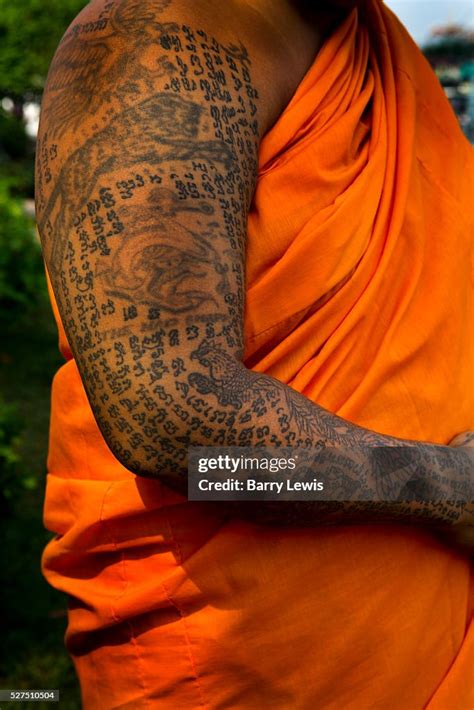 Monk With Script Tattoos