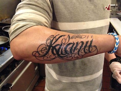 name tattoo on arm small for girl