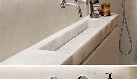 Narrow sink for a small fresh white bathroom in a swedish space