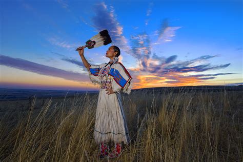 Native American woman praying to nature