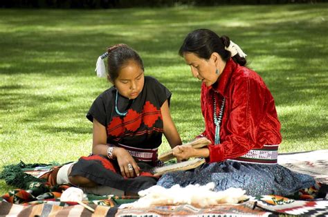Native American woman teaching children about nature