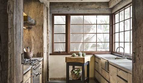 Classic country kitchen with large limestone flagstones and brass