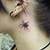 neck spider tattoo