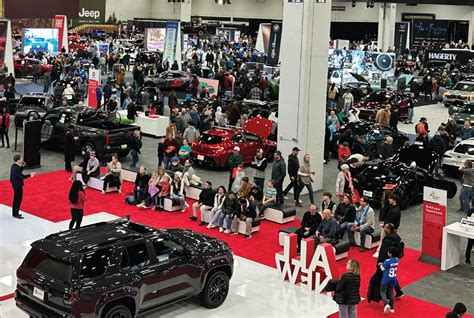 Image of a group of people networking at an auto show