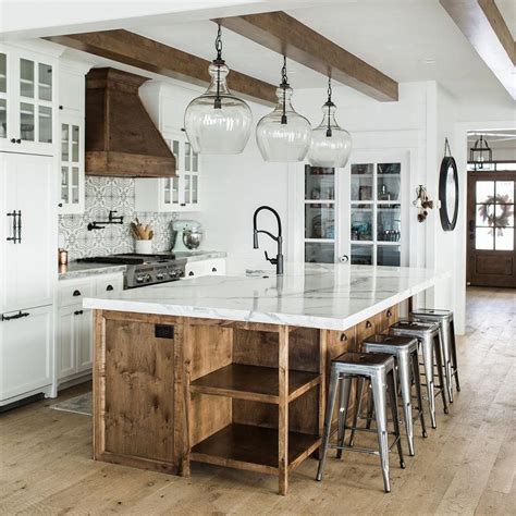 A calm and neutral kitchen that retains the character of its cottage