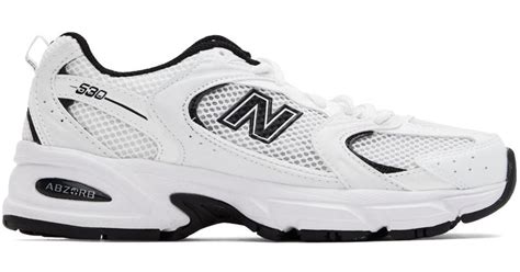 new balance 530 sneakers in white and black
