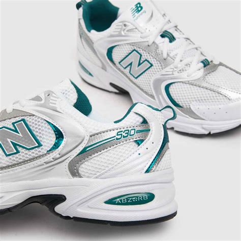 new balance 530 trainers in white and green