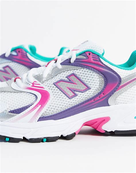 new balance 530 trainers in white and pink