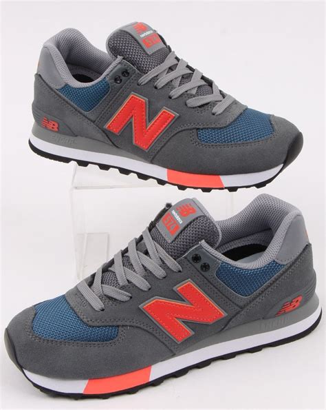 new balance 574 trainers in grey and orange