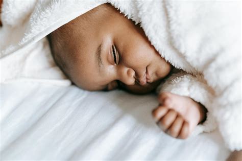 Newborn Sleeping In Bed