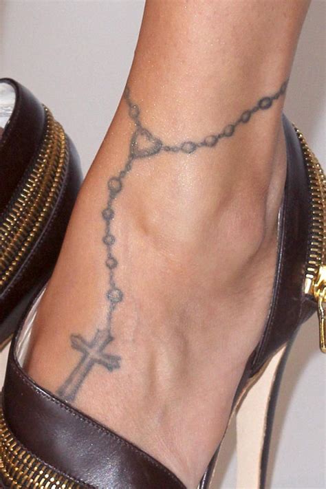 One of Nicole's first tattoos was an anklet design with a cross on