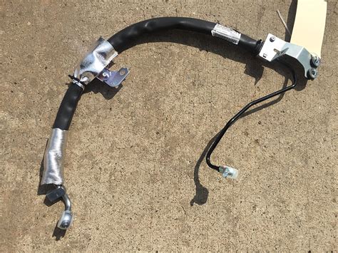 nissan maxima power steering hose replacement