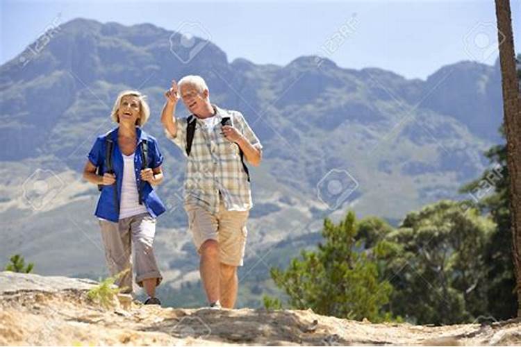Old couple hiking together