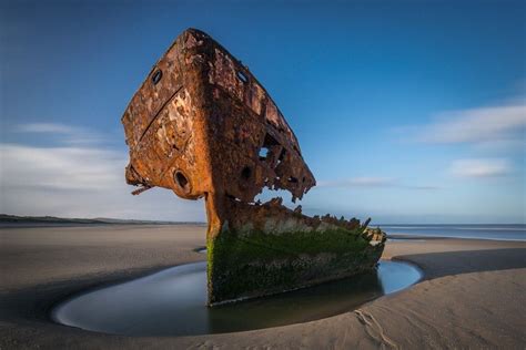 old ship wrecked on rock