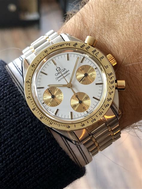 omega speedmaster gold steel