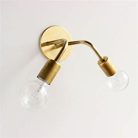 one forty three brass wall sconce