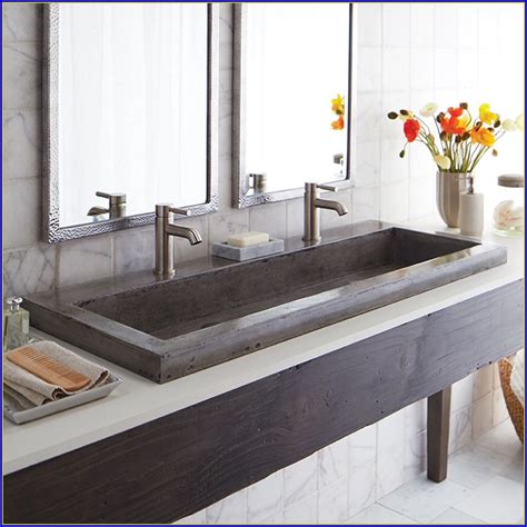 one large bathroom sink with two faucets