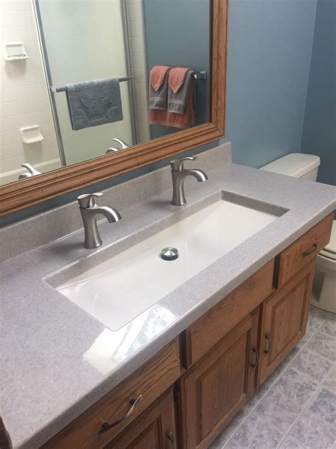 one large bathroom sink with two faucets