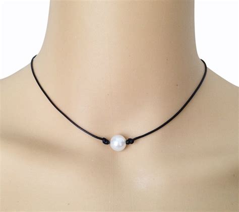 one pearl necklace on leather cord meaning