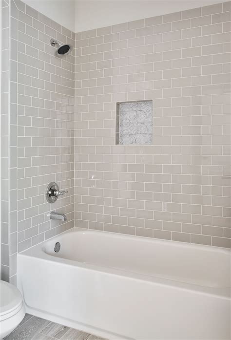 one piece tub surround vs tile