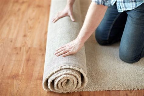 one side of area rug stays rolled up