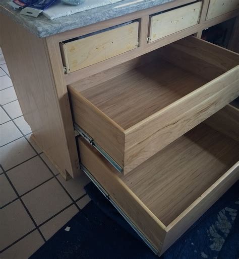 one side of drawer sticks out