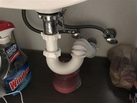one side of kitchen sink drains slowly