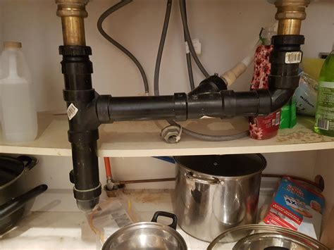 one side of kitchen sink drains slowly