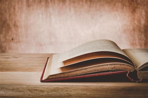 Uncover the Secrets: Exploring the Open Book on the Table - A SEO Friendly Title