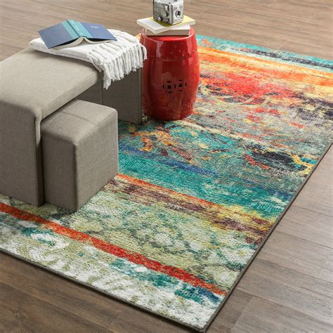 orange and teal printed area rug