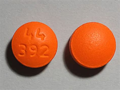 orange round pill 1/2