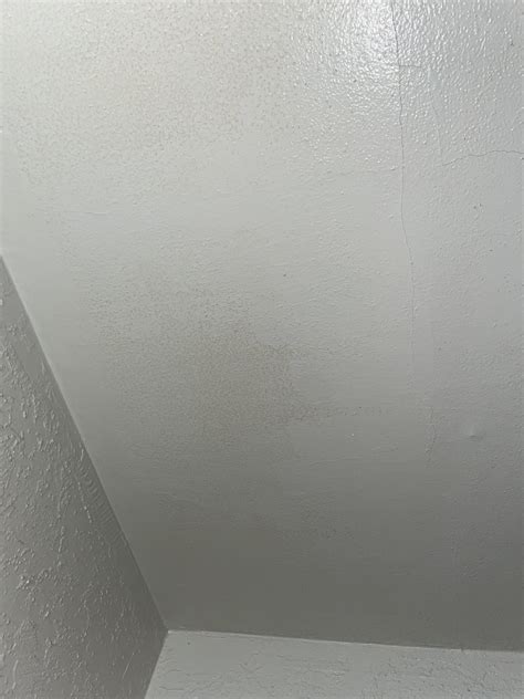 orange spots on ceiling in bedroom