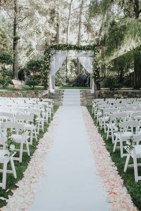 Love the set up for this outdoor wedding flower petal lined wedding
