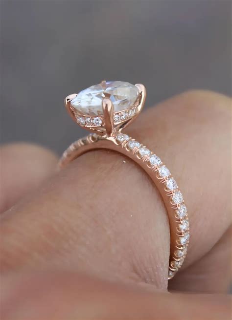oval hidden halo engagement rings