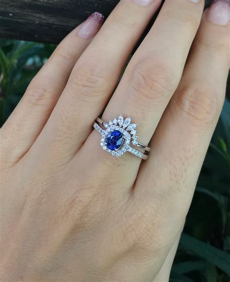 oval sapphire halo engagement rings