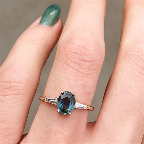 oval teal sapphire engagement rings