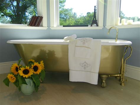Cast iron antique bath tub painted gold and refinished. By interior