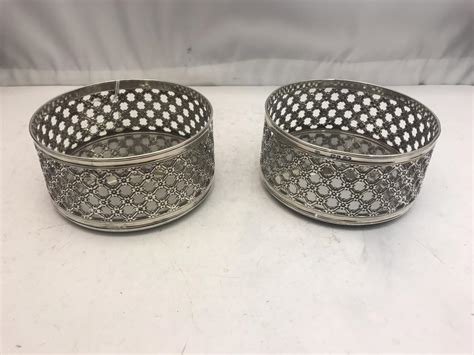 pair of sterling silver wine coasters